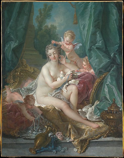 A nude Venus seated among drapery and putti, attended at her toilette, with a mirror.